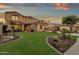 Two-story house with stone accents, landscaped lawn, and basketball court at 3829 E Sawtooth Dr, Chandler, AZ 85249