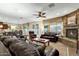 Cozy living room with a stone fireplace and leather furniture at 3829 E Sawtooth Dr, Chandler, AZ 85249