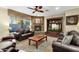 Relaxing living room with a stone fireplace and built-in media center at 3829 E Sawtooth Dr, Chandler, AZ 85249