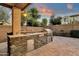 Outdoor kitchen with stone countertops and stainless steel appliances at 3829 E Sawtooth Dr, Chandler, AZ 85249