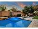 Inviting pool and spa with fire pit and comfortable seating area at 3829 E Sawtooth Dr, Chandler, AZ 85249