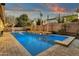 Luxury pool and spa with built-in barbecue and outdoor seating at 3829 E Sawtooth Dr, Chandler, AZ 85249