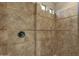 Clean shower with tile surround and decorative trim at 3829 E Sawtooth Dr, Chandler, AZ 85249