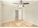 Bedroom with wood-look floors, ceiling fan and closet at 4033 N 14Th Pl, Phoenix, AZ 85014