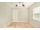 Bright bedroom with ceiling fan, light wood floors, and window blinds at 4033 N 14Th Pl, Phoenix, AZ 85014