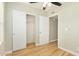 Bedroom with wood-look floors, ceiling fan and closet at 4033 N 14Th Pl, Phoenix, AZ 85014