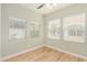 Well-lit bedroom with wood-look floors and multiple windows at 4033 N 14Th Pl, Phoenix, AZ 85014