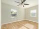 Bright bedroom with wood-look floors and ceiling fan at 4033 N 14Th Pl, Phoenix, AZ 85014