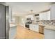 Modern kitchen with white cabinets and granite counters at 4033 N 14Th Pl, Phoenix, AZ 85014