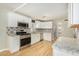 Updated kitchen featuring granite countertops and white cabinets at 4033 N 14Th Pl, Phoenix, AZ 85014