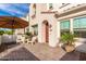 Inviting front patio with seating, umbrella, and potted plants at 4077 S Sabrina Dr # 24, Chandler, AZ 85248