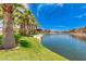 Scenic community lake with lush landscaping and palm trees at 4077 S Sabrina Dr # 24, Chandler, AZ 85248