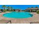 Resort-style community pool with seating and shade structures at 4077 S Sabrina Dr # 24, Chandler, AZ 85248