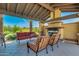 Relaxing covered patio with fireplace and comfortable seating at 4077 S Sabrina Dr # 24, Chandler, AZ 85248