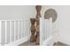 Upstairs hallway with white railings and unique wooden art at 4077 S Sabrina Dr # 24, Chandler, AZ 85248