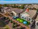 Aerial view of house, backyard, and patio with umbrellas at 4129 E Cathy Dr, Gilbert, AZ 85296