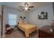 Cozy bedroom with yellow bedding, ceiling fan and light blue walls at 4129 E Cathy Dr, Gilbert, AZ 85296