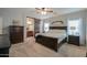 Primary bedroom with king-size bed and barn door to en-suite at 4129 E Cathy Dr, Gilbert, AZ 85296