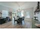 Bright dining room with a round table and four chairs, hardwood floors, and natural light at 4129 E Cathy Dr, Gilbert, AZ 85296