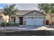 Single-story home with a two-car garage and landscaped front yard at 4129 E Cathy Dr, Gilbert, AZ 85296