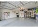 Organized garage with overhead storage and ample floor space at 4129 E Cathy Dr, Gilbert, AZ 85296