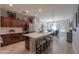 Modern kitchen featuring an island, stainless steel appliances, and wood cabinets at 4129 E Cathy Dr, Gilbert, AZ 85296