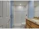 Clean bathroom with granite vanity and a glass shower at 4200 N Miller Rd # 121, Scottsdale, AZ 85251