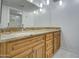 Bathroom featuring granite countertop and wood cabinets at 4200 N Miller Rd # 121, Scottsdale, AZ 85251