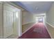 Building hallway with carpet and recessed lighting at 4200 N Miller Rd # 121, Scottsdale, AZ 85251