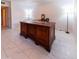 Home office with large desk and tile floor at 4200 N Miller Rd # 121, Scottsdale, AZ 85251