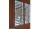 Window with white plantation shutters, offering natural light at 4200 N Miller Rd # 121, Scottsdale, AZ 85251