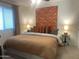 Spacious bedroom with king-size bed and unique wall art at 4444 E Paradise Village N Pkwy # 107, Phoenix, AZ 85032