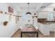 Kitchen dining area with wood table and white chairs at 4444 E Paradise Village N Pkwy # 107, Phoenix, AZ 85032