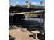 Covered parking area with designated spaces and a nearby bench at 4444 E Paradise Village N Pkwy # 107, Phoenix, AZ 85032