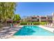 Inviting swimming pool with lounge chairs and patio tables at 4444 E Paradise Village N Pkwy # 107, Phoenix, AZ 85032