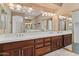 Double vanity bathroom with dark wood cabinets and a large mirror at 4739 E Casey Ln, Cave Creek, AZ 85331