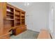 Home office features built-in wood desk and shelving at 4739 E Casey Ln, Cave Creek, AZ 85331