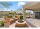 Relaxing patio area with a fire pit and built-in seating at 4739 E Casey Ln, Cave Creek, AZ 85331