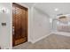 Modern hallway with wood door and carpet at 4803 N Woodmere Fairway -- # 2002, Scottsdale, AZ 85251