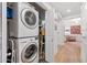 Stackable washer and dryer in a well-lit laundry closet at 4803 N Woodmere Fairway -- # 2002, Scottsdale, AZ 85251