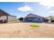 House and large backyard with sand and grass at 510 E Desert Hills Estate Dr, Phoenix, AZ 85086