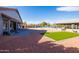 Landscaped backyard with patio and artificial turf at 510 E Desert Hills Estate Dr, Phoenix, AZ 85086