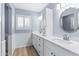 Modern bathroom with double vanity and a large mirror at 510 E Desert Hills Estate Dr, Phoenix, AZ 85086