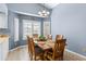 Dining area with wood table and chairs, and view to kitchen at 510 E Desert Hills Estate Dr, Phoenix, AZ 85086