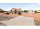 Single-story home with red tile roof, landscaped yard, and detached garage at 510 E Desert Hills Estate Dr, Phoenix, AZ 85086