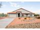 Single-story home with a two-car garage and landscaped yard at 510 E Desert Hills Estate Dr, Phoenix, AZ 85086