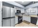 Stainless steel appliances and white cabinets in this kitchen at 510 E Desert Hills Estate Dr, Phoenix, AZ 85086