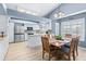 Bright kitchen with island, stainless steel appliances, and dining area at 510 E Desert Hills Estate Dr, Phoenix, AZ 85086