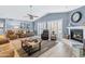 Spacious living room with fireplace and leather furniture at 510 E Desert Hills Estate Dr, Phoenix, AZ 85086