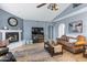 Bright living room with a fireplace and comfortable seating at 510 E Desert Hills Estate Dr, Phoenix, AZ 85086